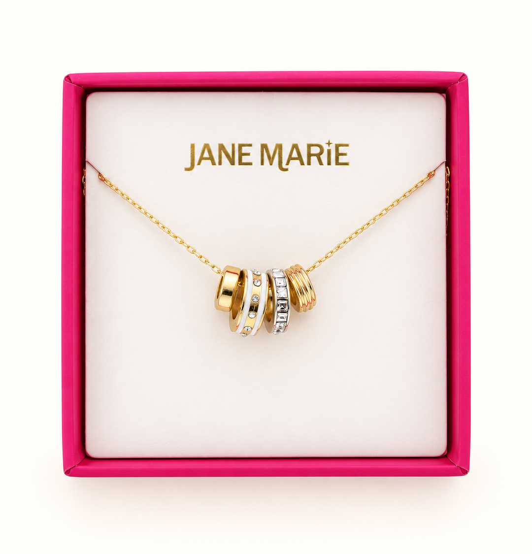 Jane Marie gold cable chain necklace featuring crystal and white rondelle pendant accents displayed in a pink jewelry gift box with branded insert.