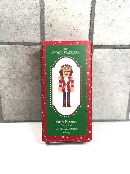 Pack of Royal Standard Bath Fixers with a nutcracker design on a gray tiled background