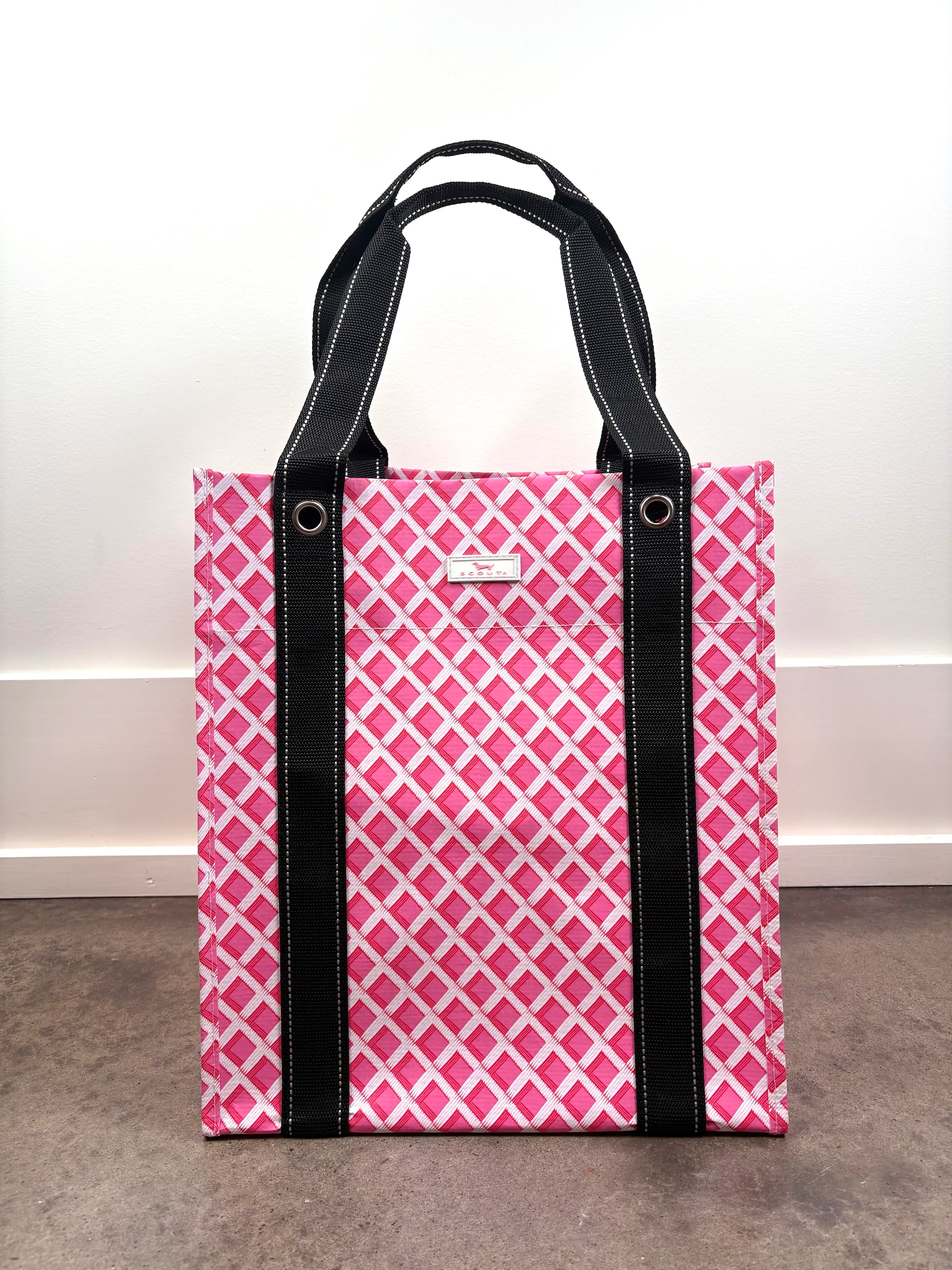 Angled view of Bagette Market Tote Bag in Stripe a Pose multicolor stripe print, durable market tote with reinforced handles.