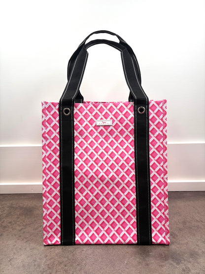 Angled view of Bagette Market Tote Bag in Stripe a Pose multicolor stripe print, durable market tote with reinforced handles.