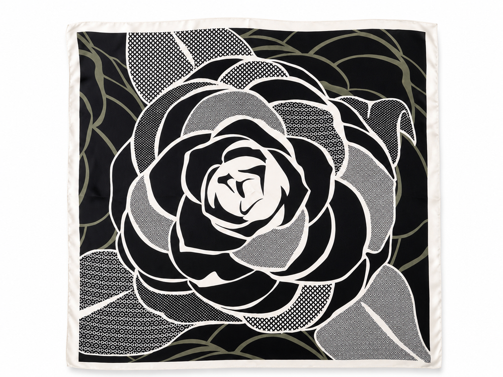 A square scarf featuring a large black and white rose design with sage patterned accents and a white border, shown flat against a white background.