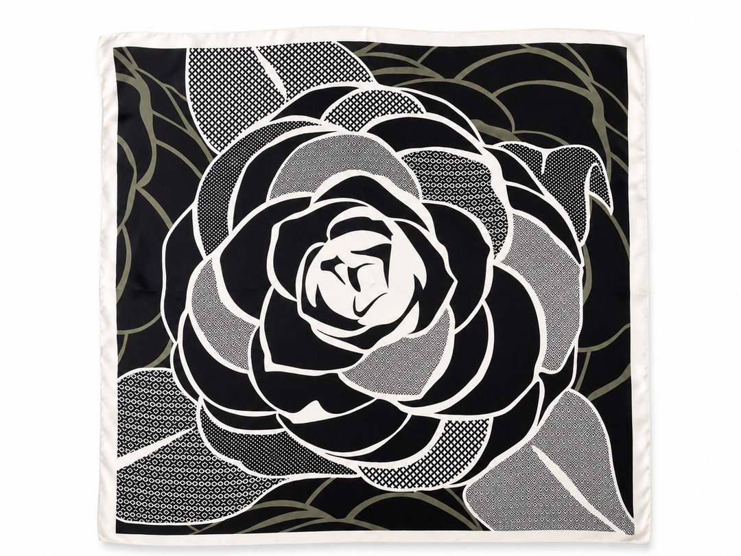 A square scarf featuring a large black and white rose design with sage patterned accents and a white border, shown flat against a white background.