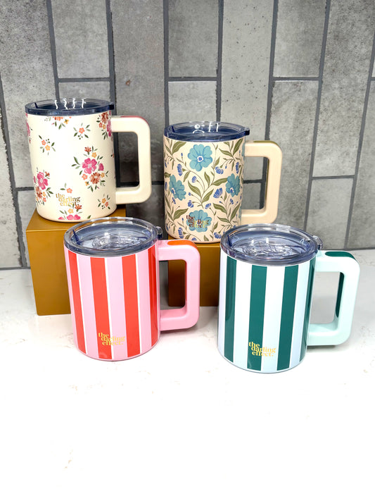 14 oz insulated coffee mugs by The Darling Effect featuring pink stripes, green stripes, and floral prints with handles and clear lids