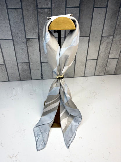 Katie Loxton Satin Multiway Scarf in sage and pastel blue ripple stripe print, silky square scarf.