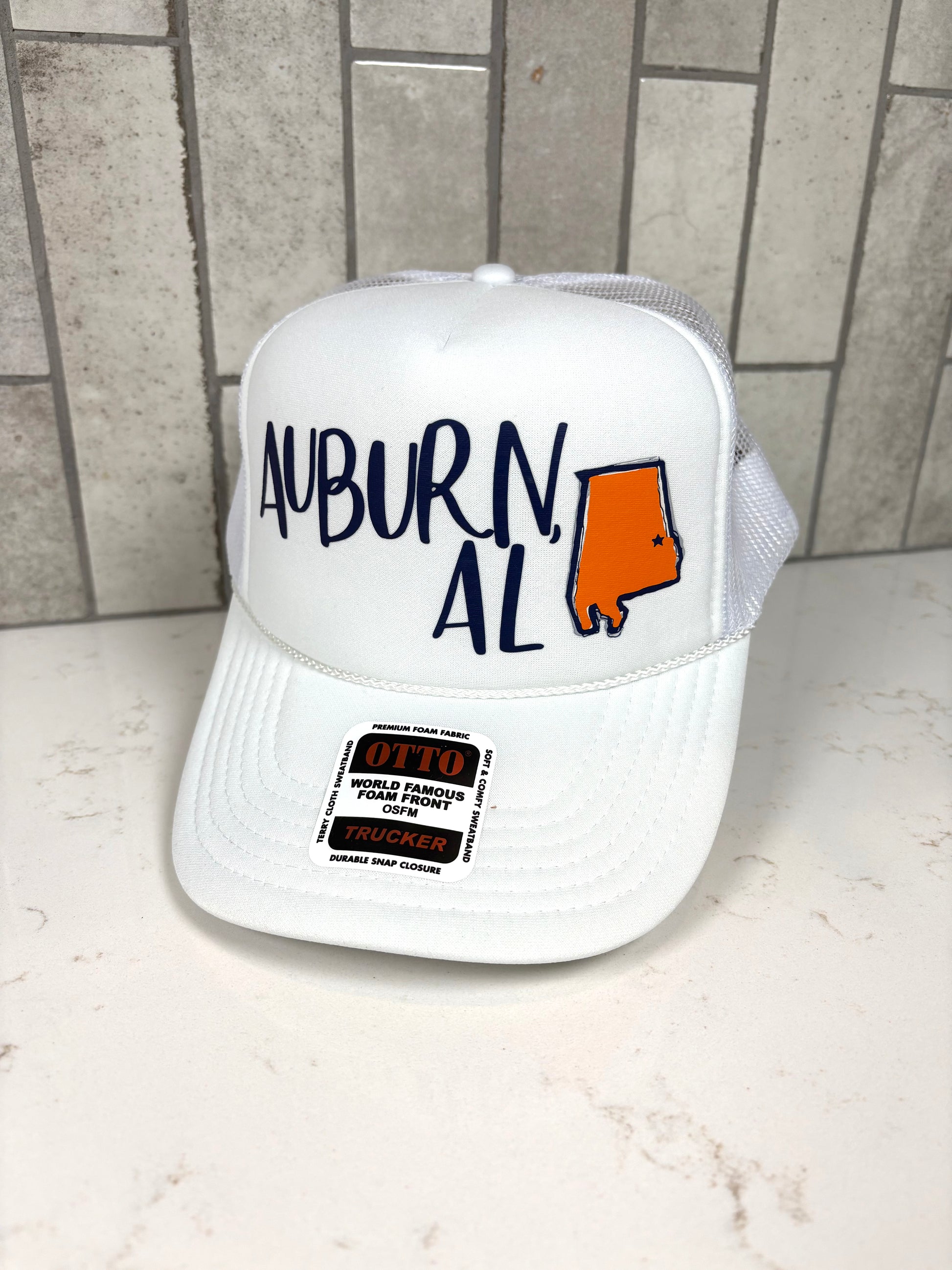 White Auburn AL trucker hat with blue embroidery and Alabama state graphic