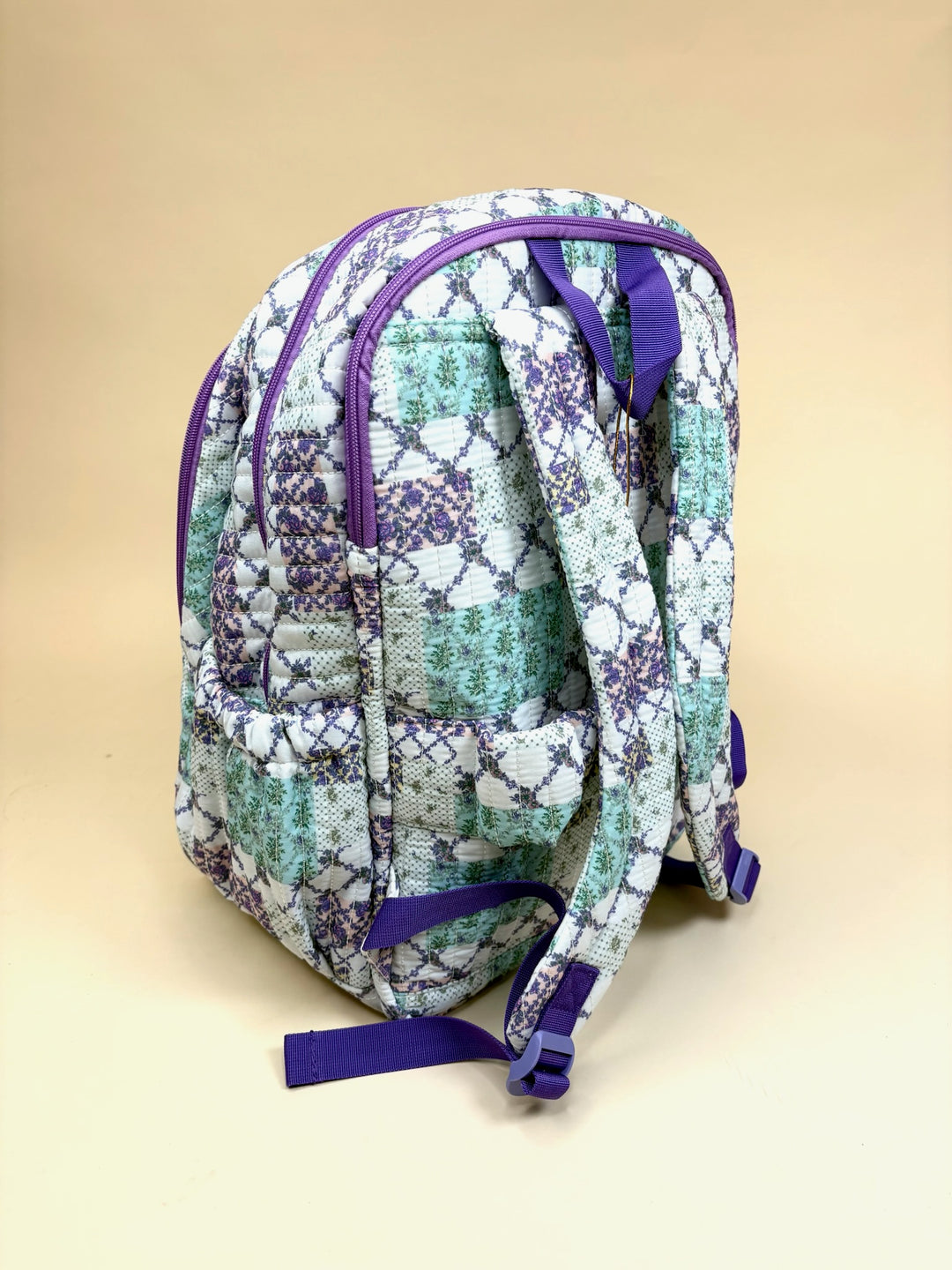 Back view of the Simply Southern Trail Patch Quilted Backpack with adjustable padded shoulder straps, quilted construction, and side storage pockets.