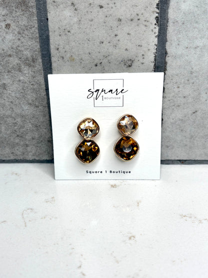 Gold double crystal drop earrings in champagne and amber tones on Square 1 Boutique card – women’s boutique accessories
