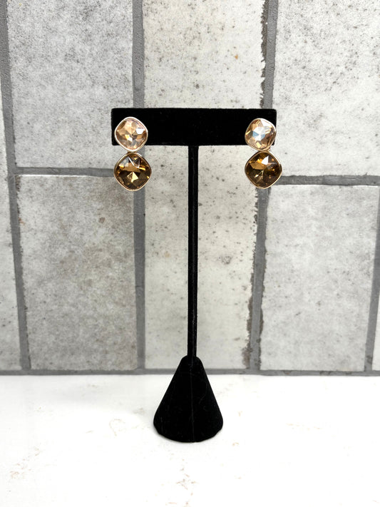Gold double stone drop earrings with champagne and amber crystals on black display stand – elegant boutique jewelry