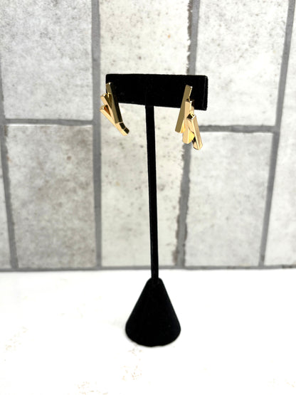 Gold geometric bar drop earrings on black stand – modern minimalist women’s boutique jewelry