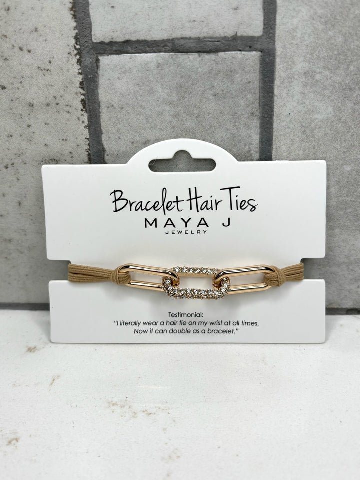 Gold rhinestone bracelet hair tie, beige elastic hair tie bracelet, Maya J Jewelry accessory, crystal link hair tie, fashionable hair tie bracelet for women, chic everyday wrist accessory