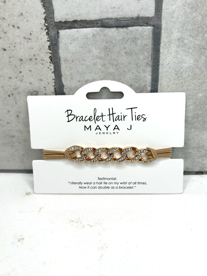Gold chain bracelet hair tie with rhinestone accents, beige elastic hair tie bracelet, Maya J Jewelry accessory, crystal chain hair tie, fashionable wrist hair tie for women, chic bracelet ponytail holder, gold hair tie bracelet accessory