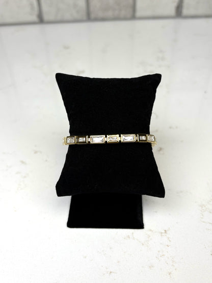 Chan Sutt Pearls Luda bracelet gold baguette crystal bracelet on black display pillow – statement gold jewelry