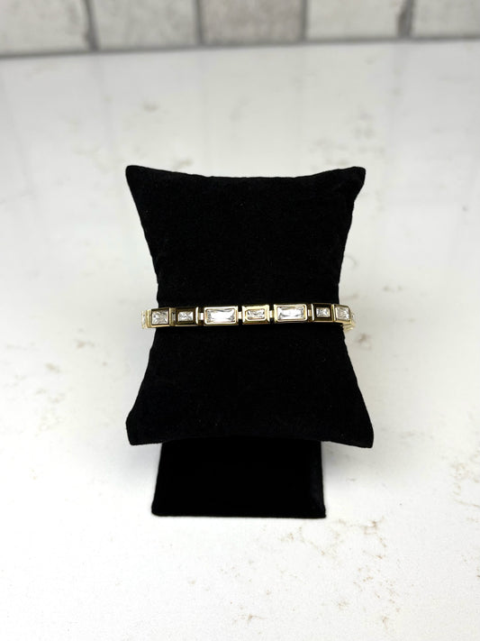 Chan Sutt Pearls Luda bracelet gold baguette crystal bracelet on black display pillow – statement gold jewelry