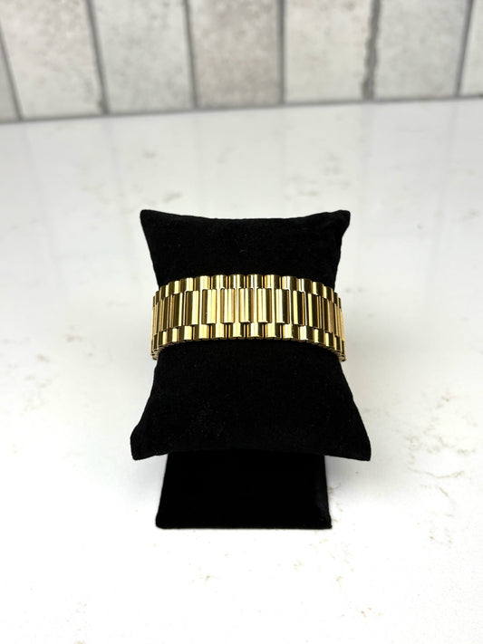 Chan Sutt Pearls thick gold watch band bracelet on black display, chunky gold link statement bracelet