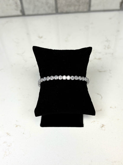 Chan Sutt Pearl silver stretchy tennis bracelet with round crystal stones on black display pillow
