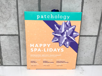 Patchology Happy Spa-Lidays skincare kit on a tiled surface
