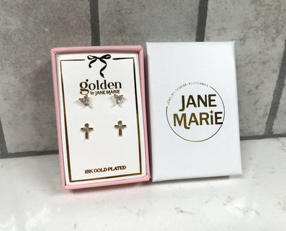 Kids 18K gold-plated earring set by Jane Marie featuring crystal heart studs and gold cross studs with crystal centers, displayed in a pink box with white Jane Marie sleeve.