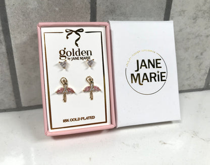Kids 18K gold-plated earring set by Jane Marie featuring crystal heart studs and pink ballerina stud earrings, displayed in a pink jewelry box with a white Jane Marie sleeve.