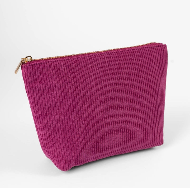 Raspberry corduroy carry-all pouch with gold zipper, cotton lining, and spacious cosmetic organizer design by Elyse Breanne Designs.