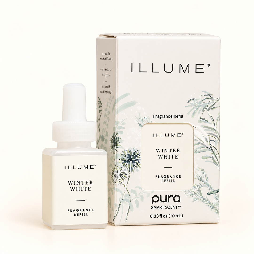 Illume Winter White Pura fragrance refill featuring a 10 mL scent bottle and botanical-inspired packaging with winter greenery and floral accents.