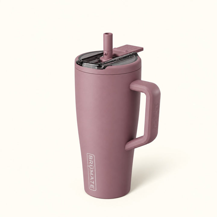 BrüMate Era Flip 30oz insulated straw tumbler in Rose Taupe featuring a soft matte dusty rose finish, matching carrying handle, covered flip-down straw lid shown open, and vertical white BrüMate branding. The compact 30oz leakproof water tumbler has a cupholder-friendly base and is displayed against a soft cream studio background.