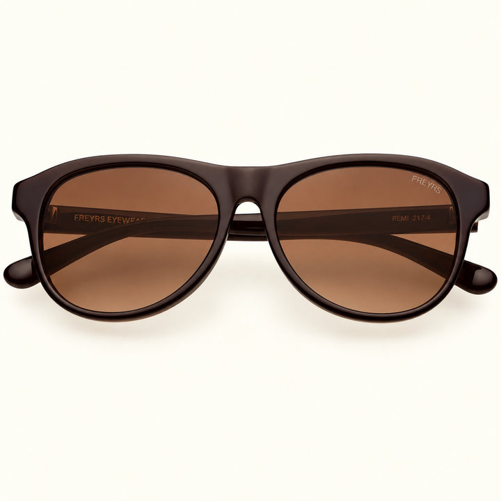 Front view of FREYRS Remi unisex sunglasses in Chocolate Brown featuring handmade acetate frames, warm brown gradient lenses, and a retro-inspired rounded rectangular shape.