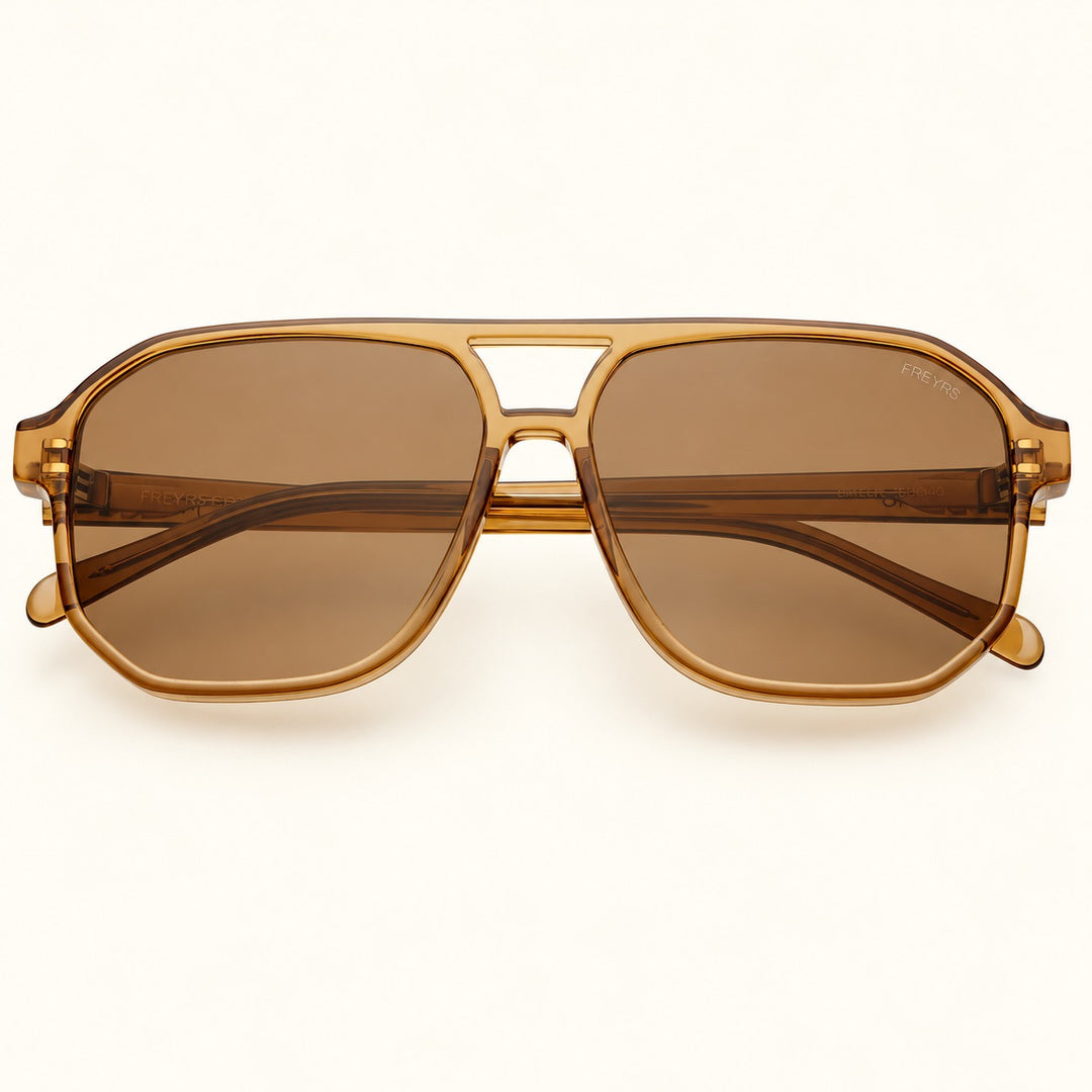 Front view of FREYRS Billie unisex aviator sunglasses in Brown featuring translucent amber-brown acetate frames, brown lenses, and a retro double-bridge design.