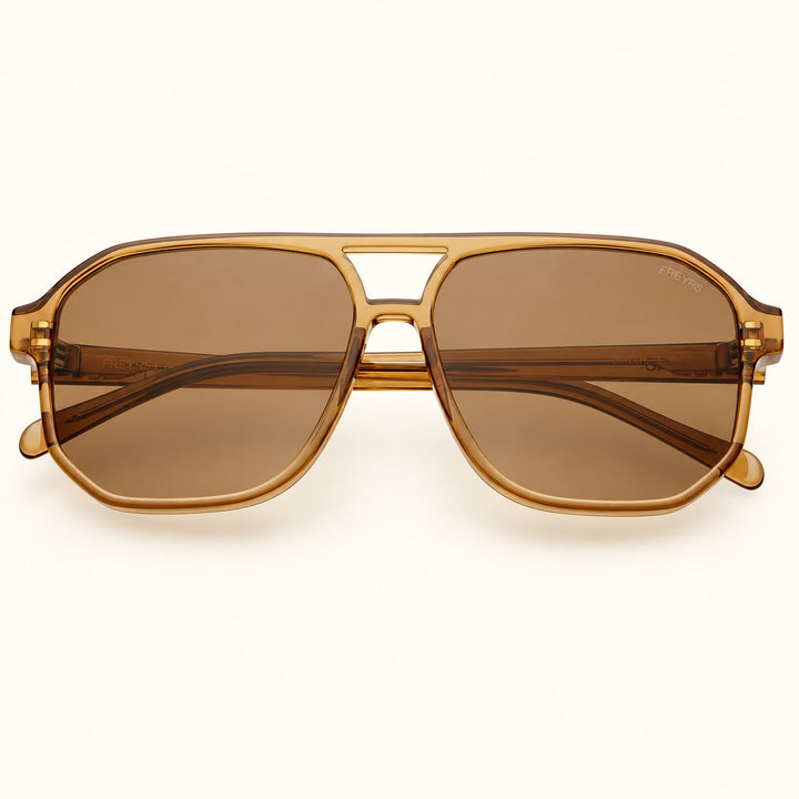 Front view of FREYRS Billie unisex aviator sunglasses in Brown featuring translucent amber-brown acetate frames, brown lenses, and a retro double-bridge design.
