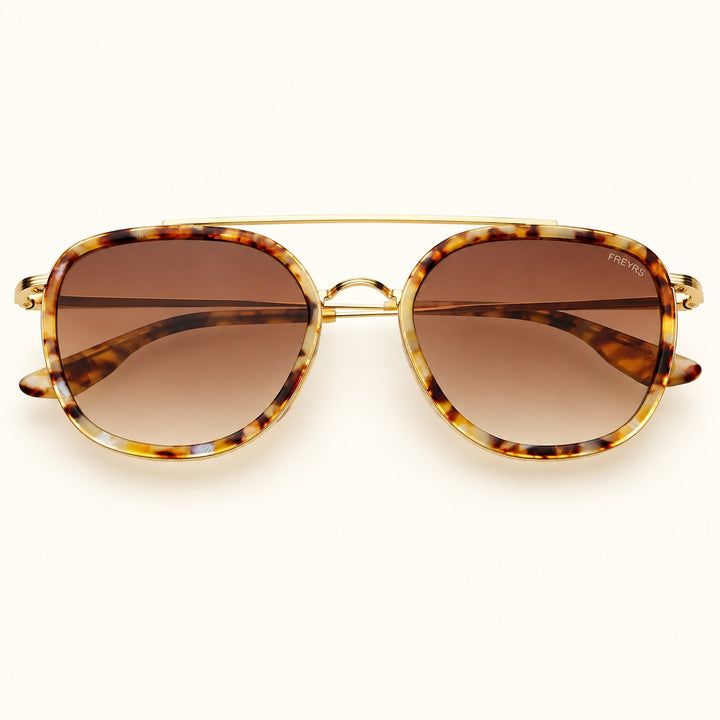 Front view of FREYRS Weston unisex round sunglasses in Brown Pearl featuring tortoiseshell acetate frames, brown gradient lenses, and a gold-tone double bridge.