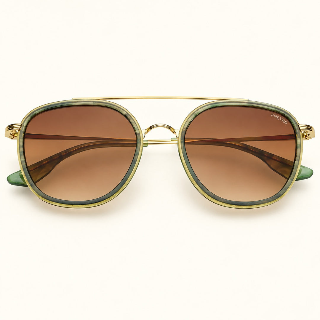 Front view of FREYRS Weston unisex round sunglasses in Emerald featuring green acetate frames, brown gradient lenses, and a gold-tone double bridge.