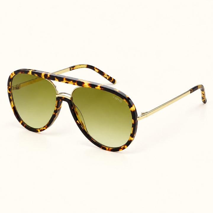Angled view of FREYRS Shay Tortoise / Light Green aviator sunglasses showing biodegradable tortoiseshell acetate frames, green gradient lenses, slim gold-tone temples, and matching tortoiseshell tips.