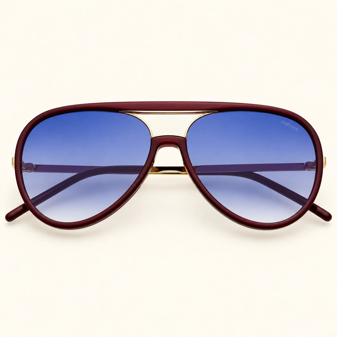 Front view of FREYRS Shay unisex aviator sunglasses in Burgundy featuring deep burgundy acetate frames, blue gradient lenses, and a gold-tone double-bridge design.
