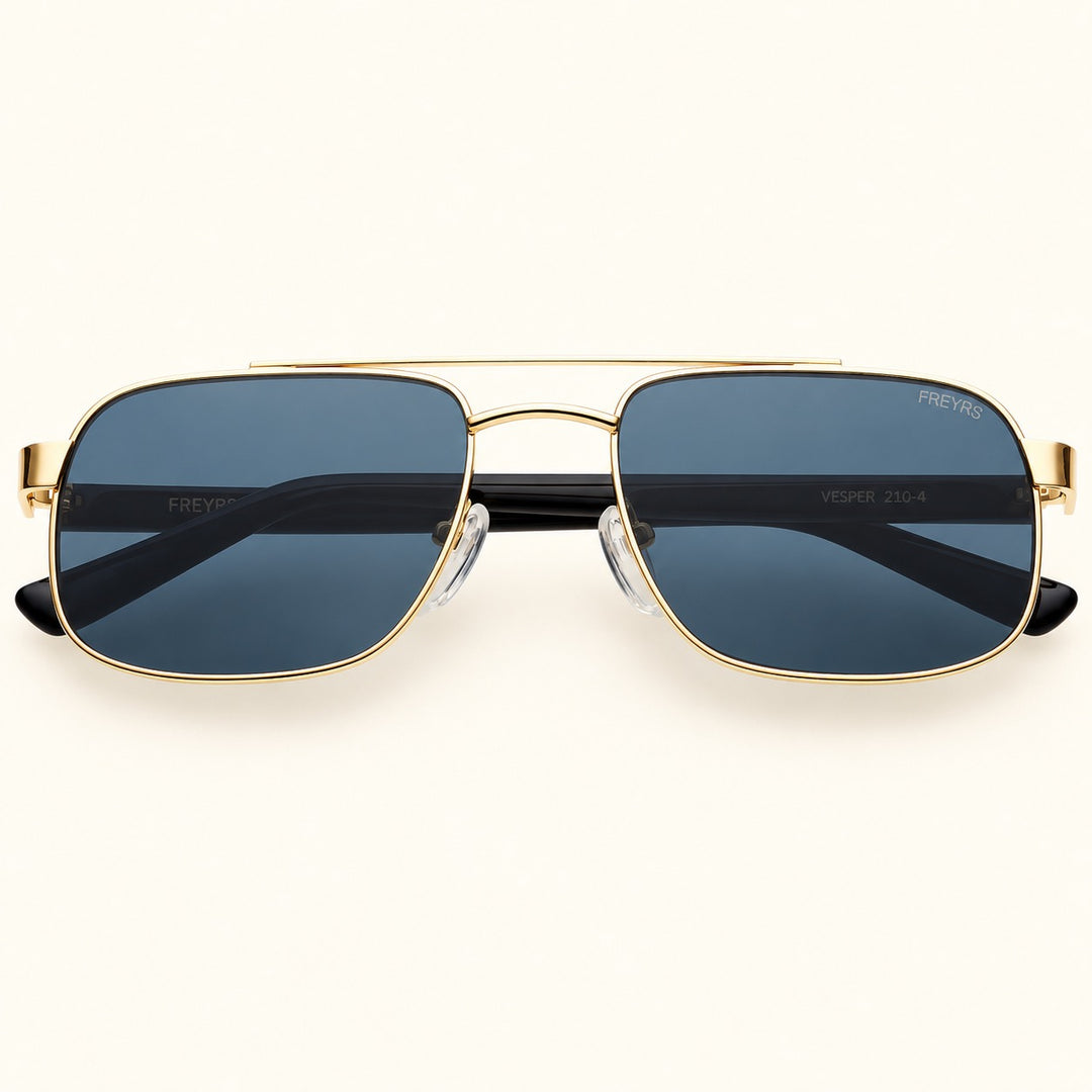 Front view of FREYRS Vesper unisex aviator sunglasses in Gold / Gray featuring a gold-tone rectangular metal frame, solid gray lenses, and double-bridge design.