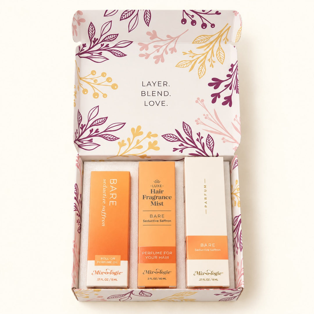 Open Mixologie Bare Seductive Saffron Perfume Gift Set displaying 5 mL roll-on perfume oil, 8 mL parfum spray, and 60 mL hair fragrance mist.