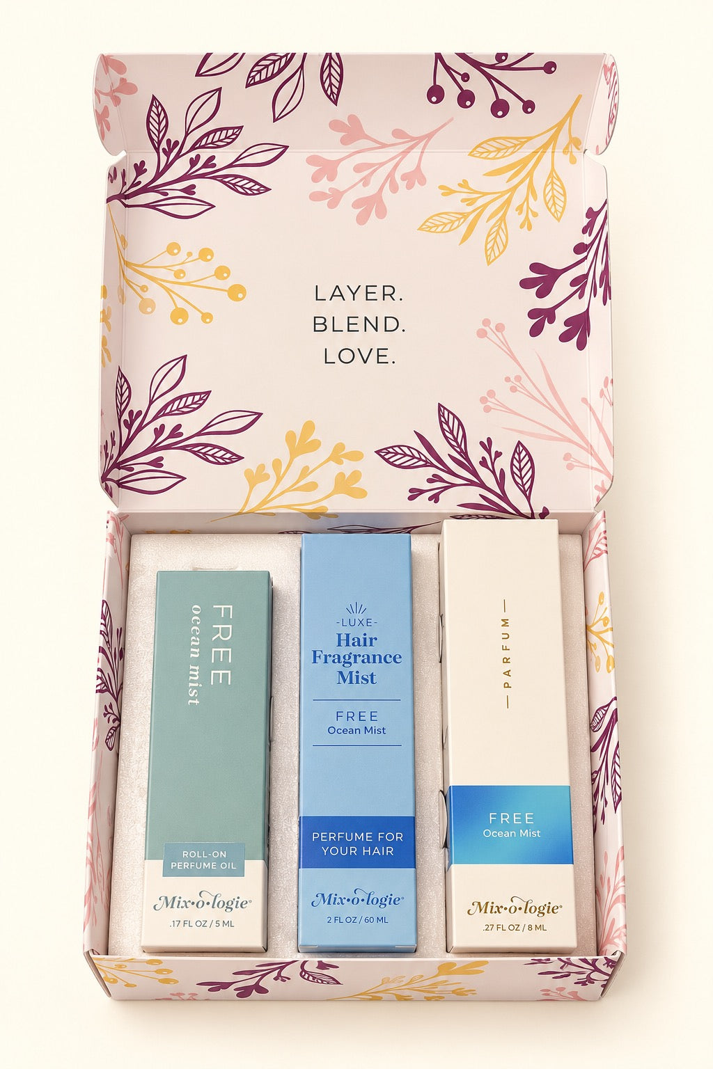 Open Mixologie Free Ocean Mist Perfume Party Gift Set featuring 5 mL roll-on perfume oil, 8 mL parfum spray, and 60 mL hair fragrance mist in a floral gift box.
