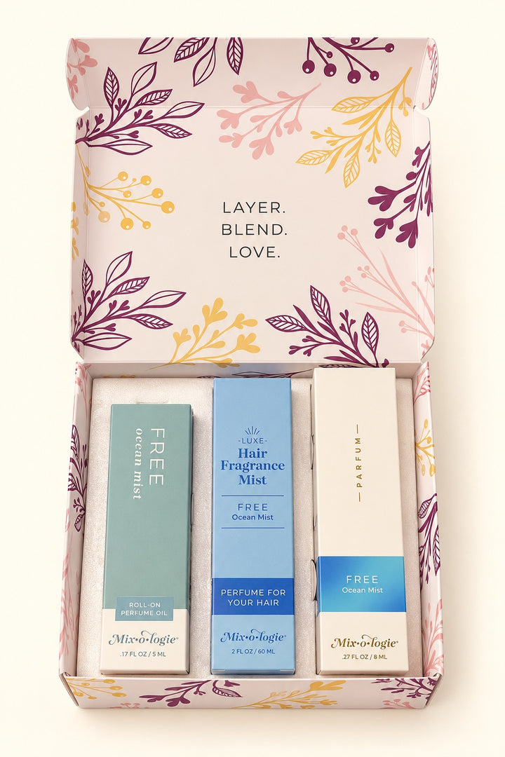 Open Mixologie Free Ocean Mist Perfume Party Gift Set featuring 5 mL roll-on perfume oil, 8 mL parfum spray, and 60 mL hair fragrance mist in a floral gift box.
