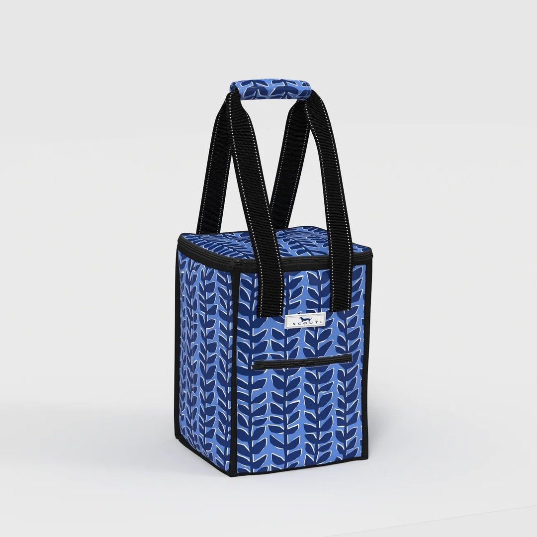 A blue and navy patterned soft-sided cooler bag with black handles and trim, shown on a clean light gray studio background.