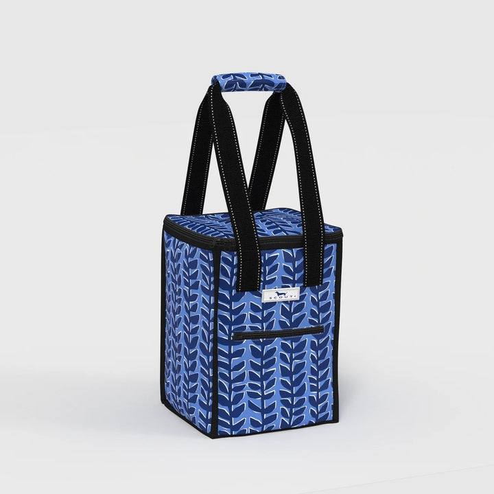A blue and navy patterned soft-sided cooler bag with black handles and trim, shown on a clean light gray studio background.
