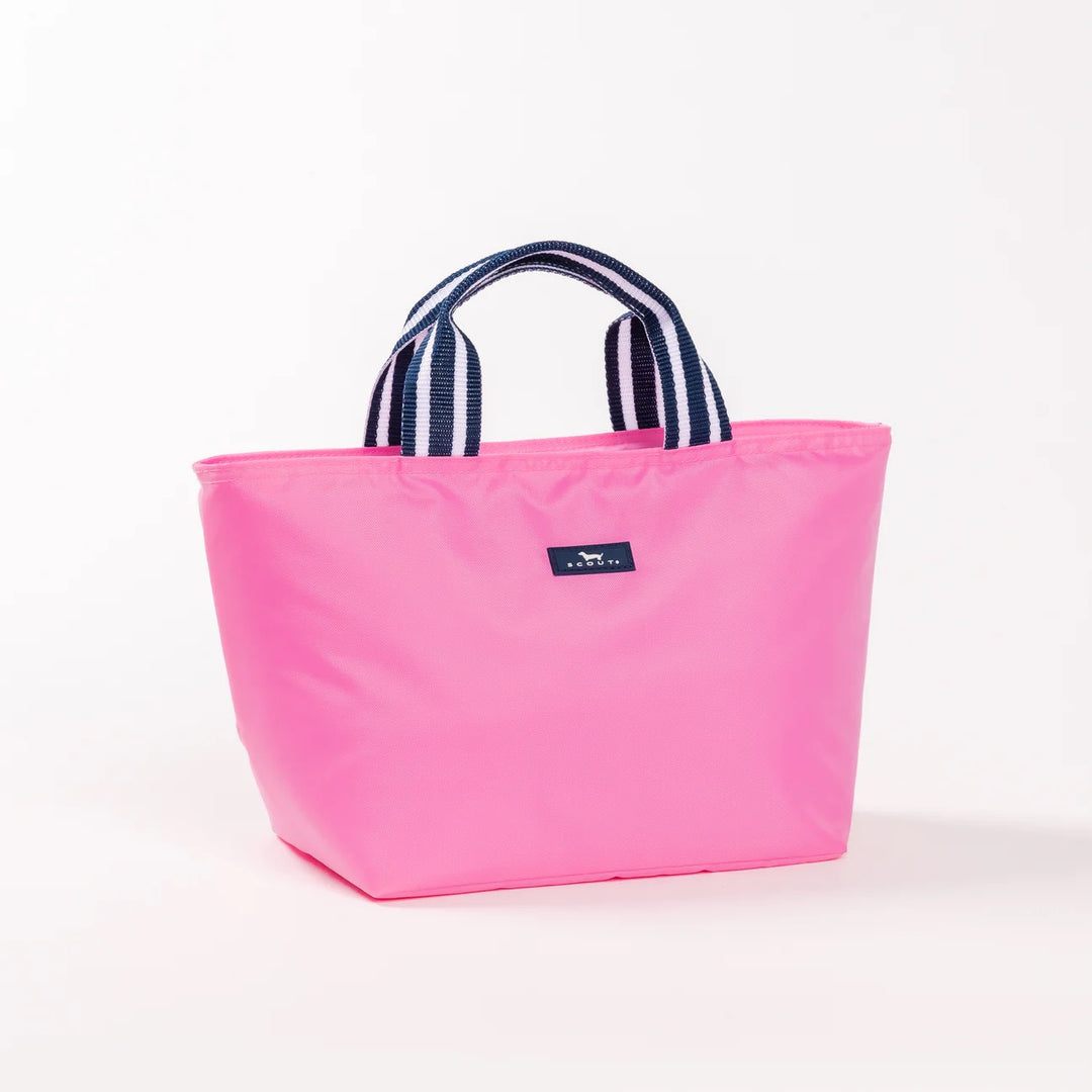 A bright pink insulated lunchbox with navy and white striped fabric handles and a small navy brand patch on the front, photographed on a clean white background.