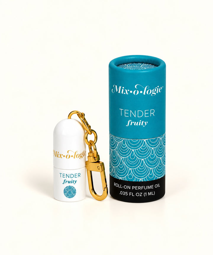 Mixologie Tender Fruity mini roll-on perfume oil keychain with gold clip, white bottle, and teal patterned packaging.