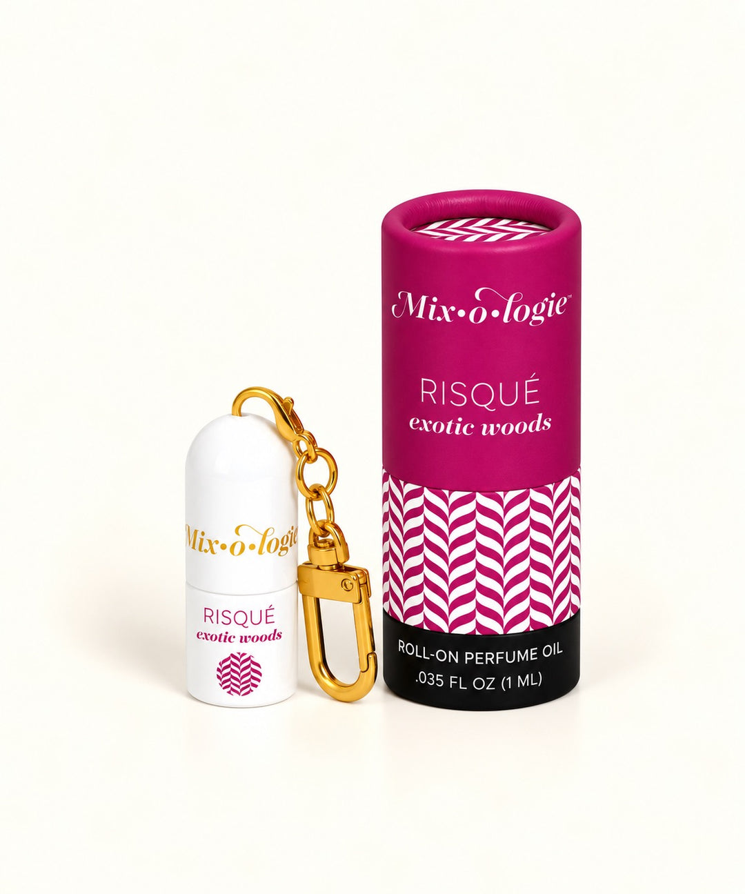 Mixologie Risqué Exotic Woods 1 mL roll-on perfume keychain with gold clasp and magenta patterned fragrance tube.