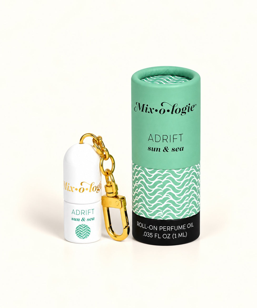 Mixologie Adrift Sun and Sea mini perfume oil keychain with gold clasp and mint green wave-patterned packaging.