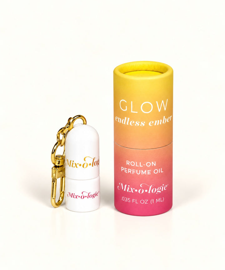 Mixologie Glow Endless Ember mini roll-on perfume oil keychain with gold clasp and yellow-to-pink gradient packaging.