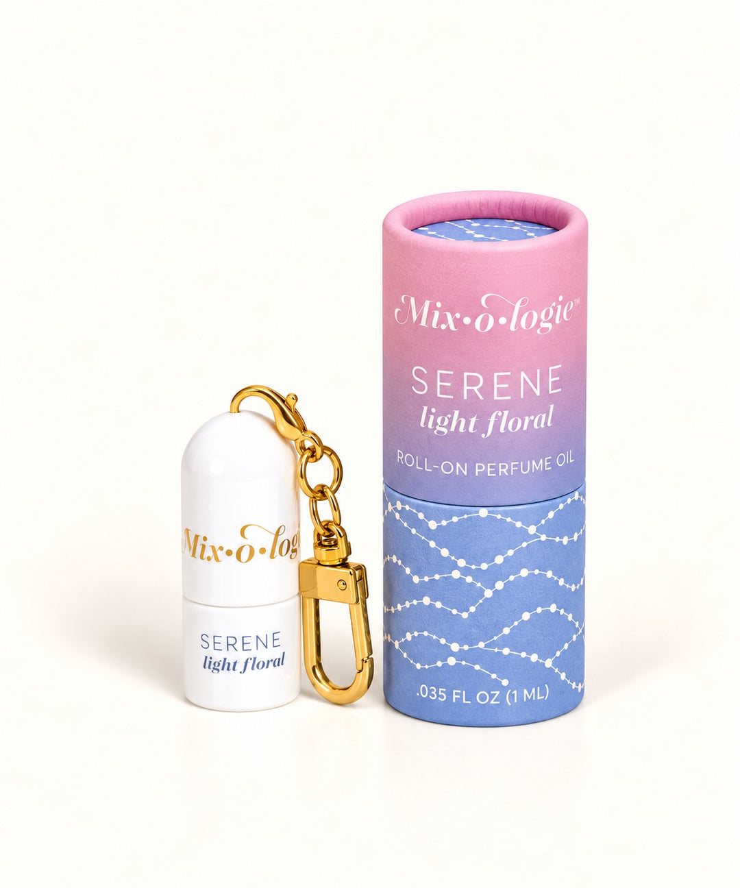 Mixologie Serene Light Floral 1 mL perfume oil keychain with gold clip and pink-to-lavender floral-inspired packaging.