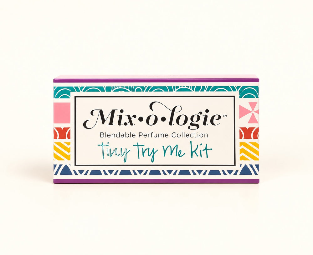 Mixologie Tiny Try Me Kit 10-piece perfume sampler in colorful geometric gift packaging, featuring the Blendable Perfume Collection of alcohol-free fragrance oils.