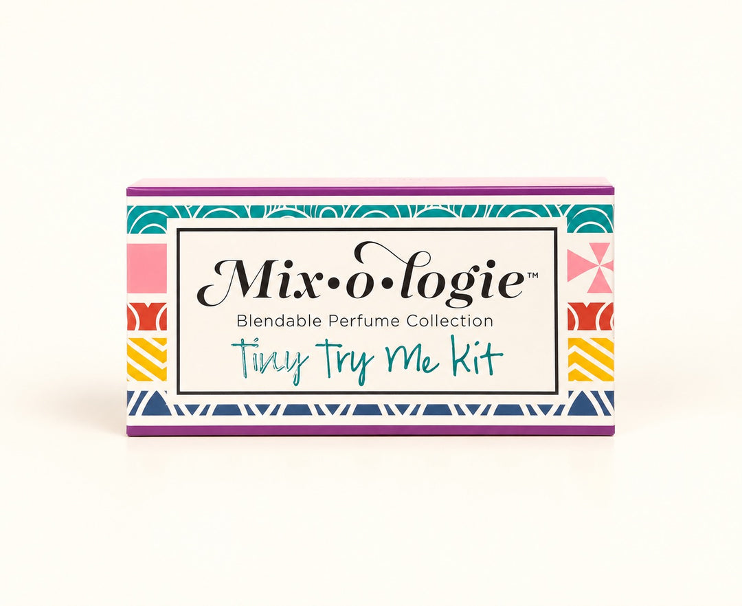Mixologie Tiny Try Me Kit 10-piece perfume sampler in colorful geometric gift packaging, featuring the Blendable Perfume Collection of alcohol-free fragrance oils.