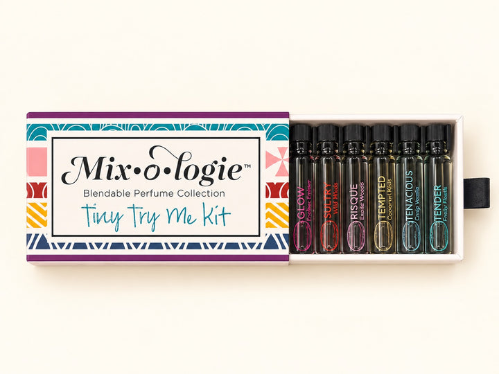Mixologie Tiny Try Me Kit open perfume discovery set featuring miniature alcohol-free fragrance oil vials in a colorful sliding gift box, perfect for layering and blending scents.