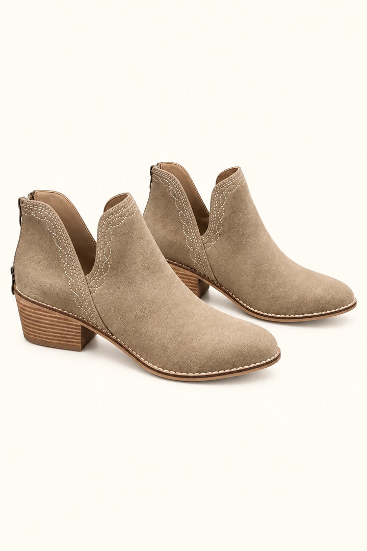 Corkys Dive Bar taupe western ankle booties with contrast stitching, side cutouts, back zippers, pointed toes, and stacked block heels.