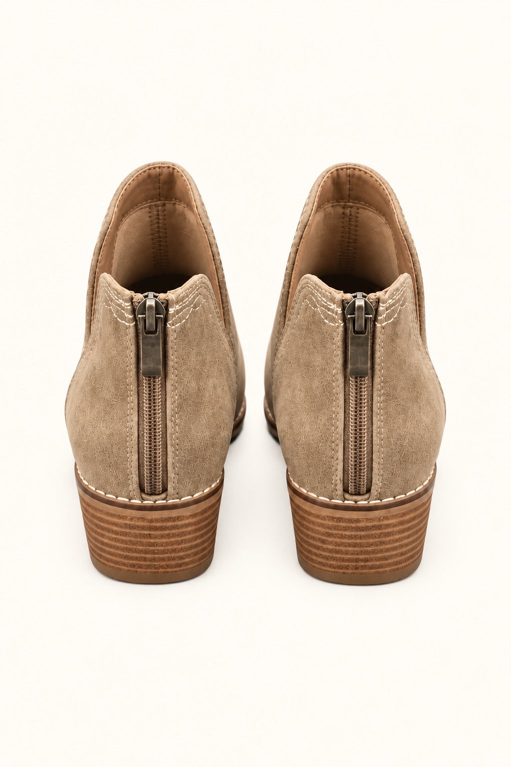 Rear view of Corkys Dive Bar taupe western ankle booties showing full back zipper closures, contrast stitching, and stacked block heels.