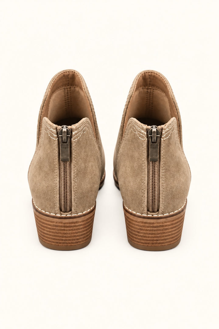 Rear view of Corkys Dive Bar taupe western ankle booties showing full back zipper closures, contrast stitching, and stacked block heels.